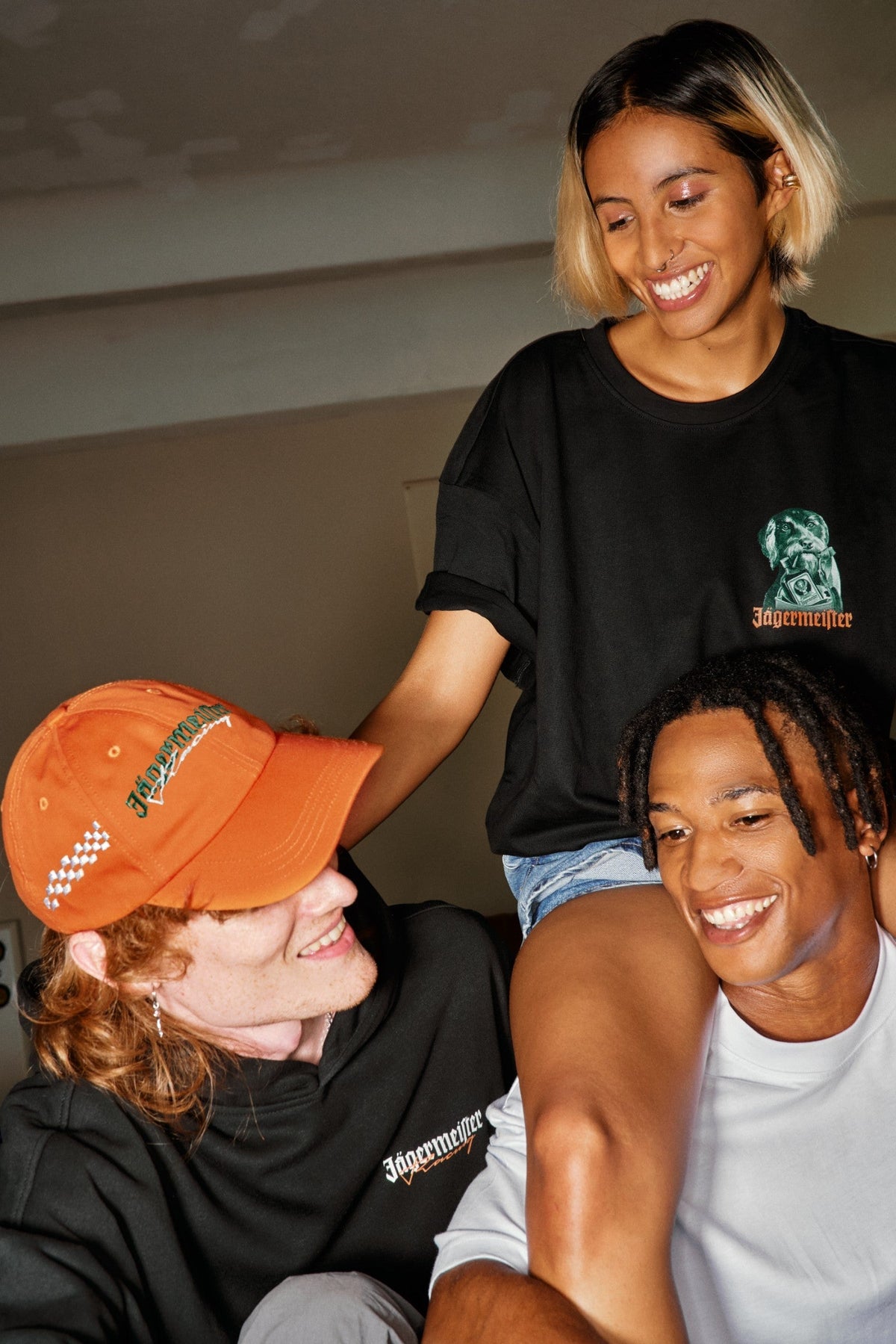 Jägermeister merchandise worn in a casual indoor setting, highlighting branded apparel and accessories.