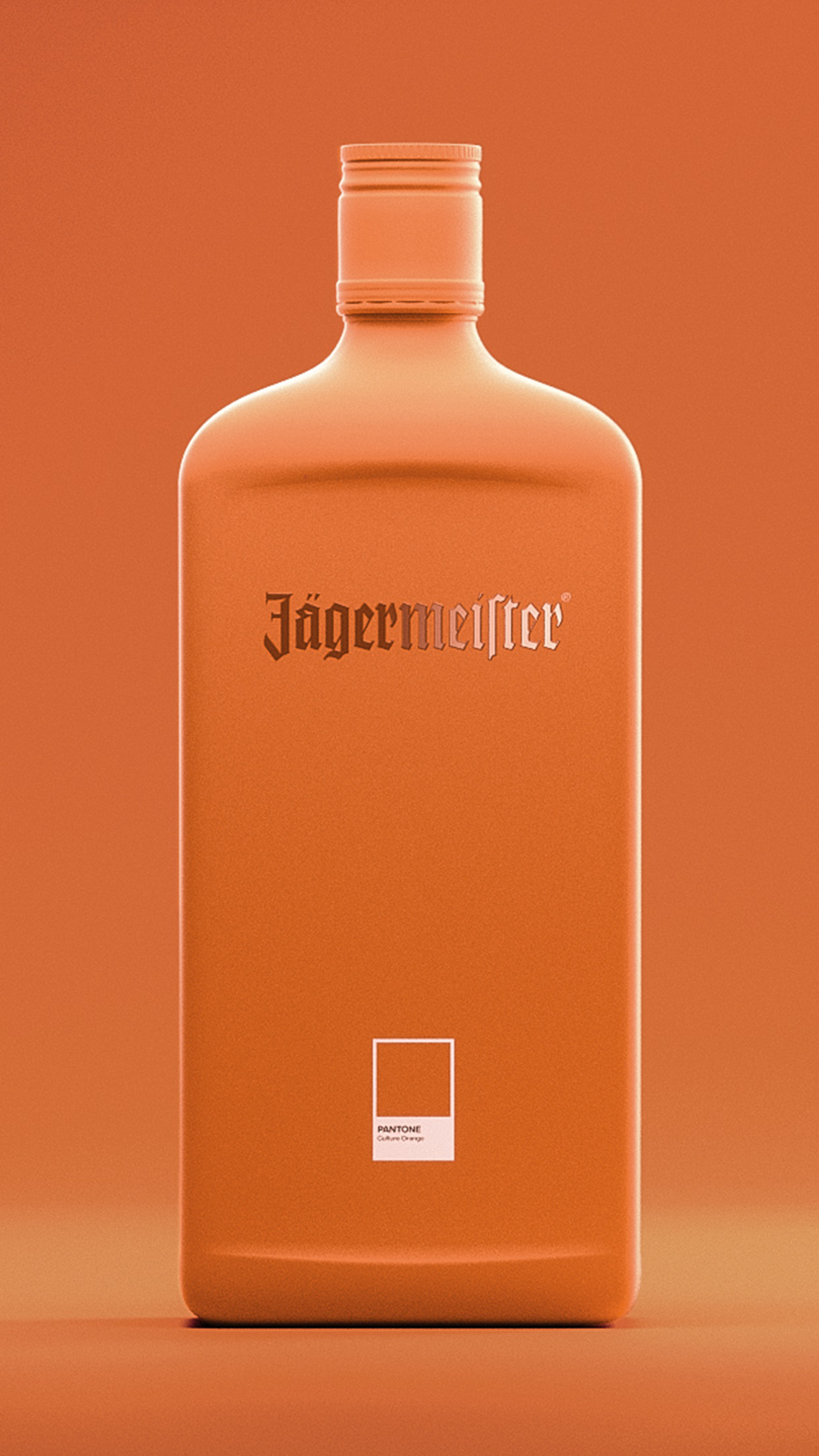 A matte orange Jägermeistef bottle with a matching screw cap, centered against a solid orange background. The brand name 'Jägermeister' is printed in a dark gothic font on the front, and a small white square label is positioned near the bottom.