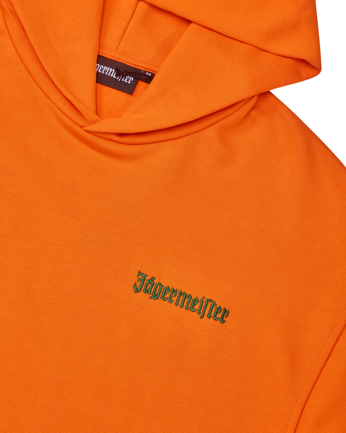 Orange hoodie with green Jägermeister wordmark on the chest.