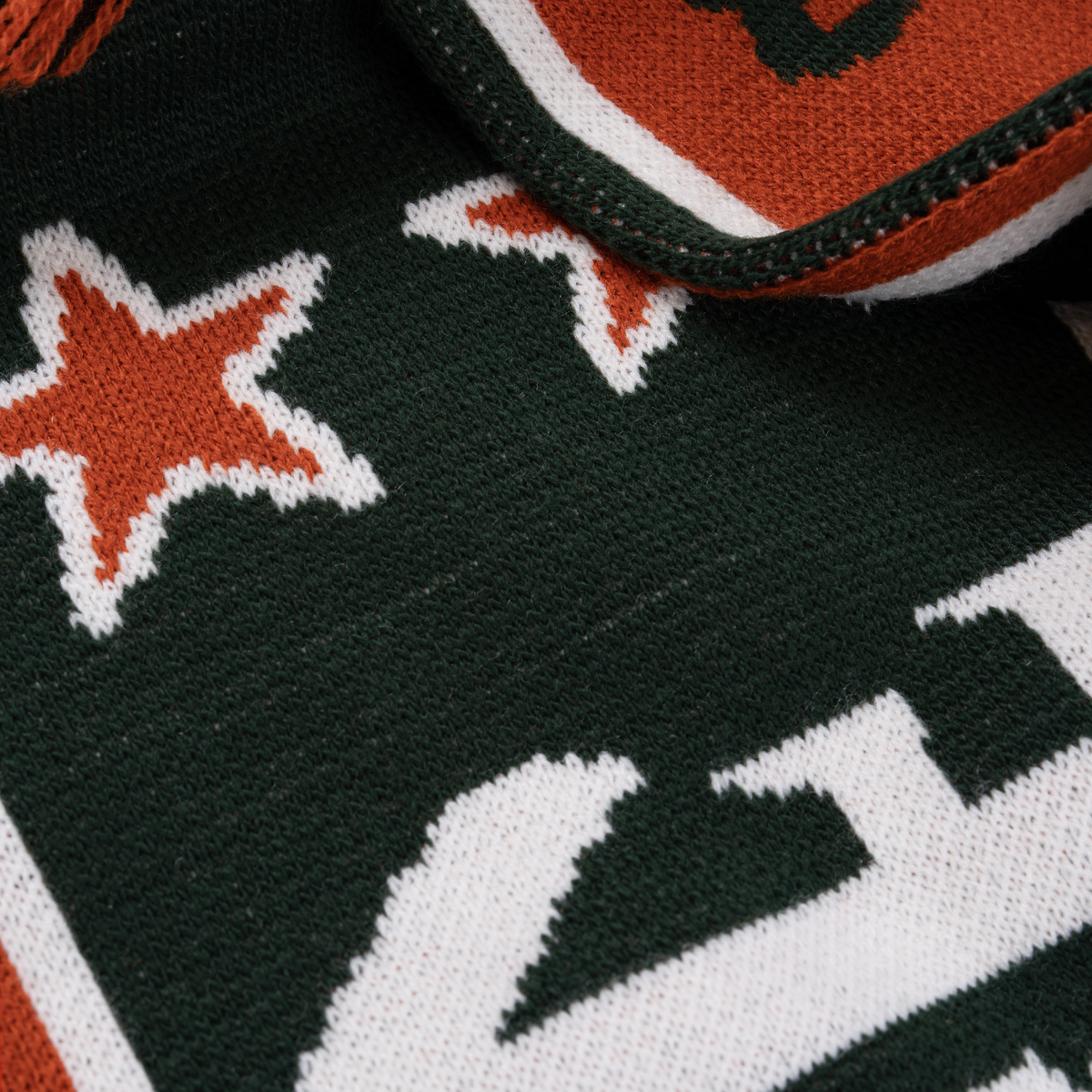 Close-up of the fabric and design of the Jägermeister Racing Scarf