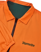 Close-up of the reversible Jägermeister jacket with a zipper showing the orange side