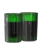 Two green shot glasses with Jägermeister branding and liquid in it