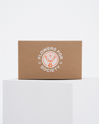 A brown kraft paper box with a white printed Jägermeister logo reading 'FLOWERS FOR SOCIETY'