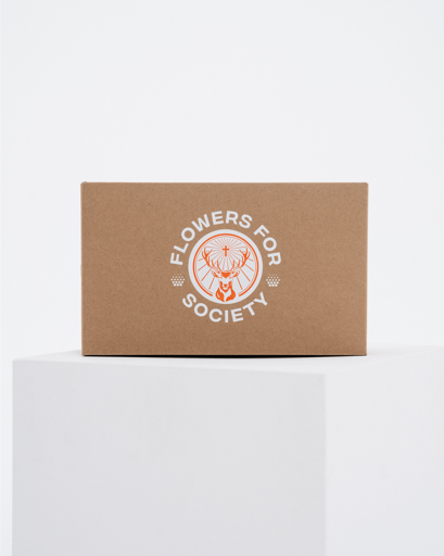 A brown kraft paper box with a white printed Jägermeister logo reading 'FLOWERS FOR SOCIETY'