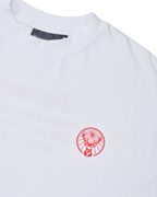 White t-shirt with an orange Jägermeister logo.