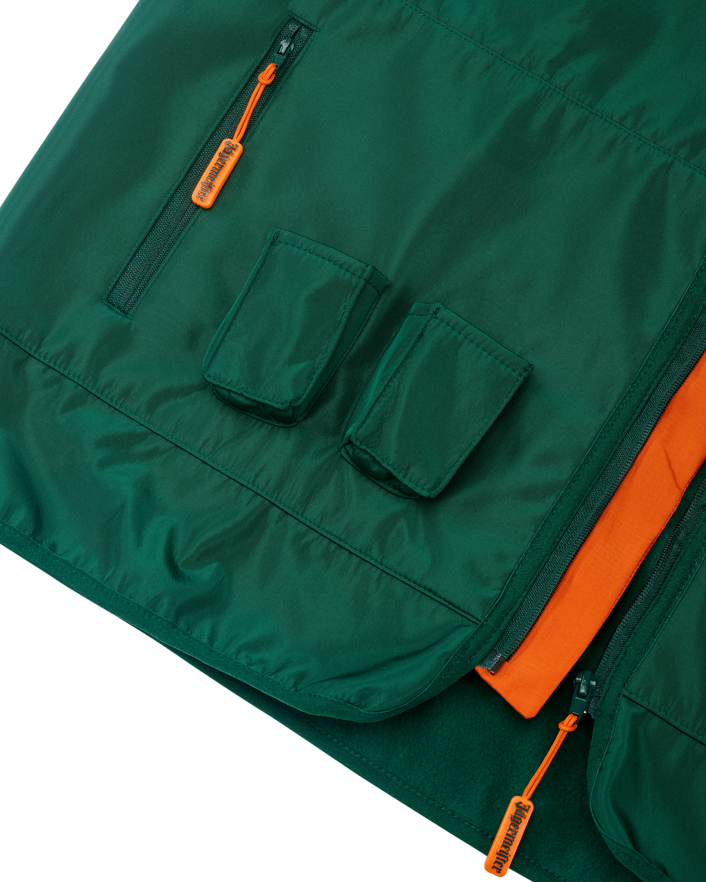 Green vest with orange accents and two small pockets for Jägermeister Minis.
