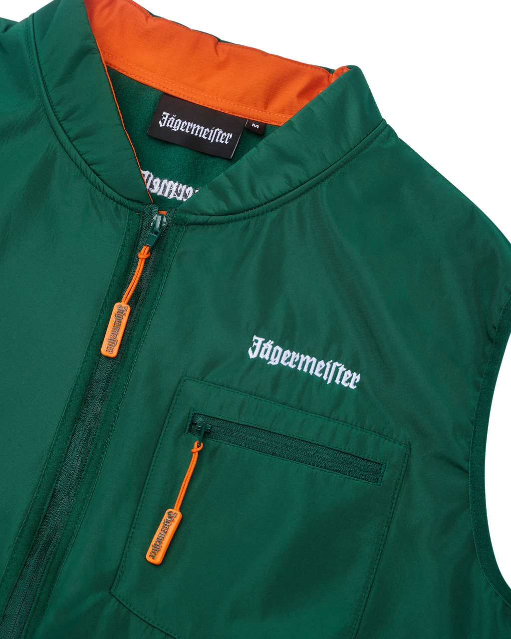 Green vest with orange interior and white Jägermeister branding.