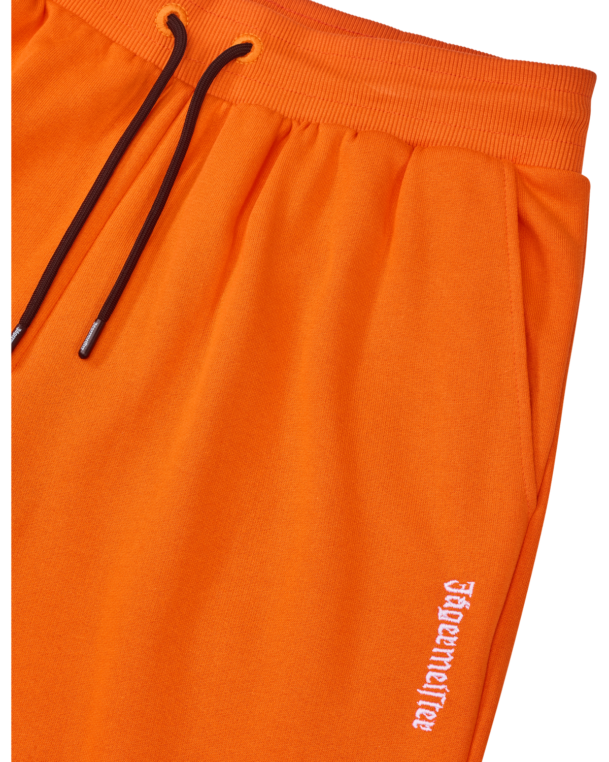 Orange Jägermeister sweatpants with a black drawstring and a white brand logo.