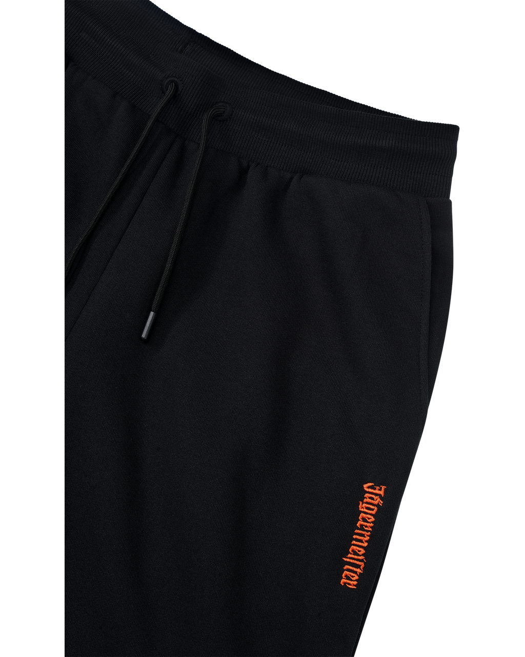 Black track pants with orange Jägermeister logo on the side.